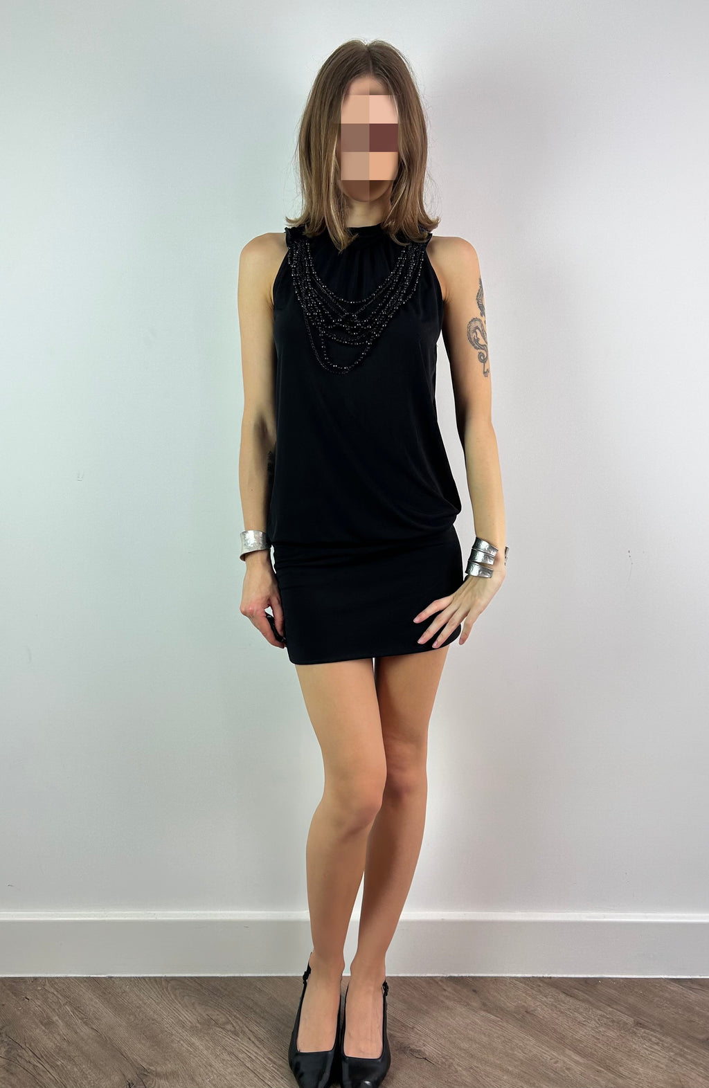 Black Mini Dress with Open Back and Beaded Necklace
