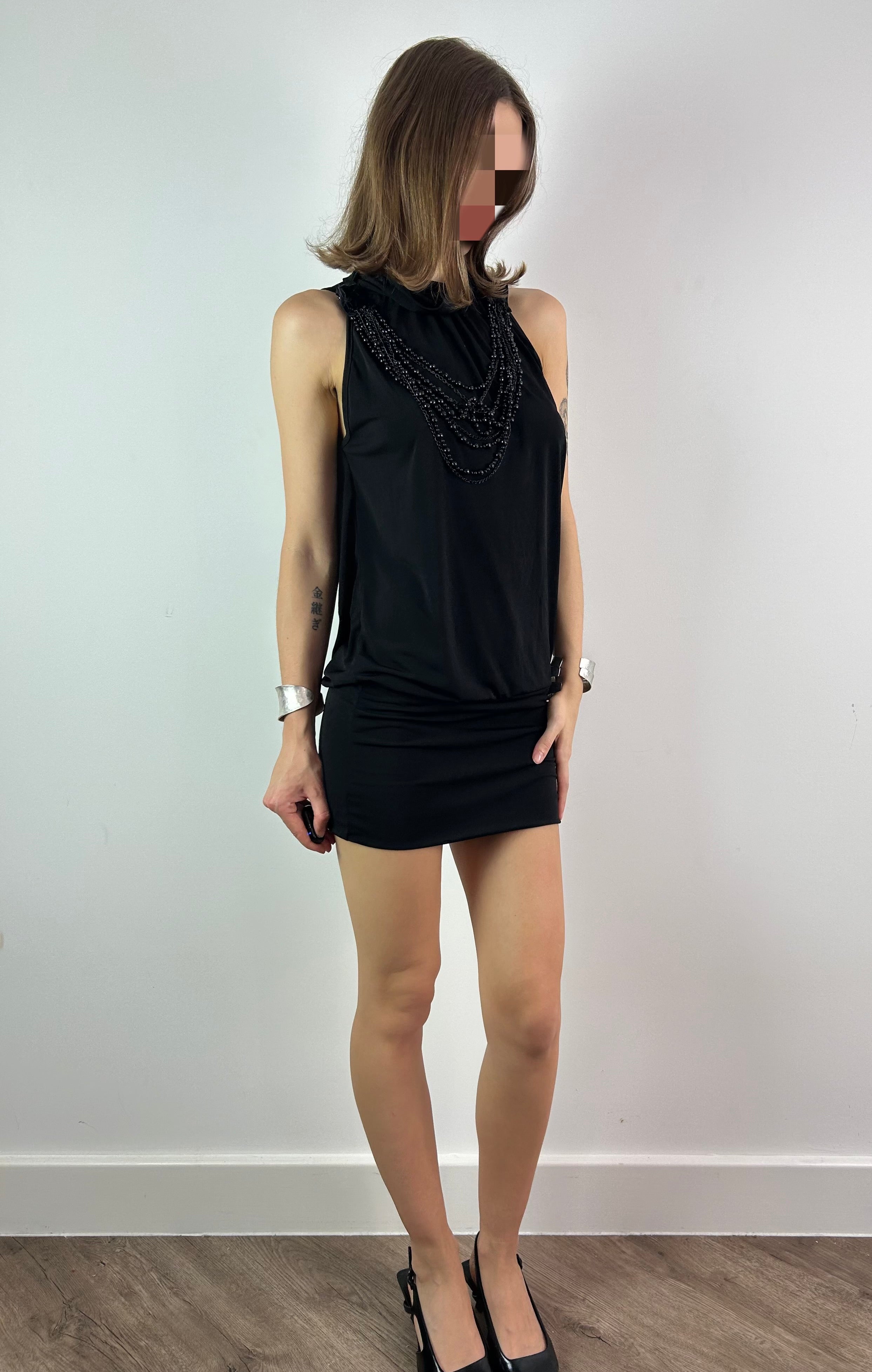 Black Mini Dress with Open Back and Beaded Necklace