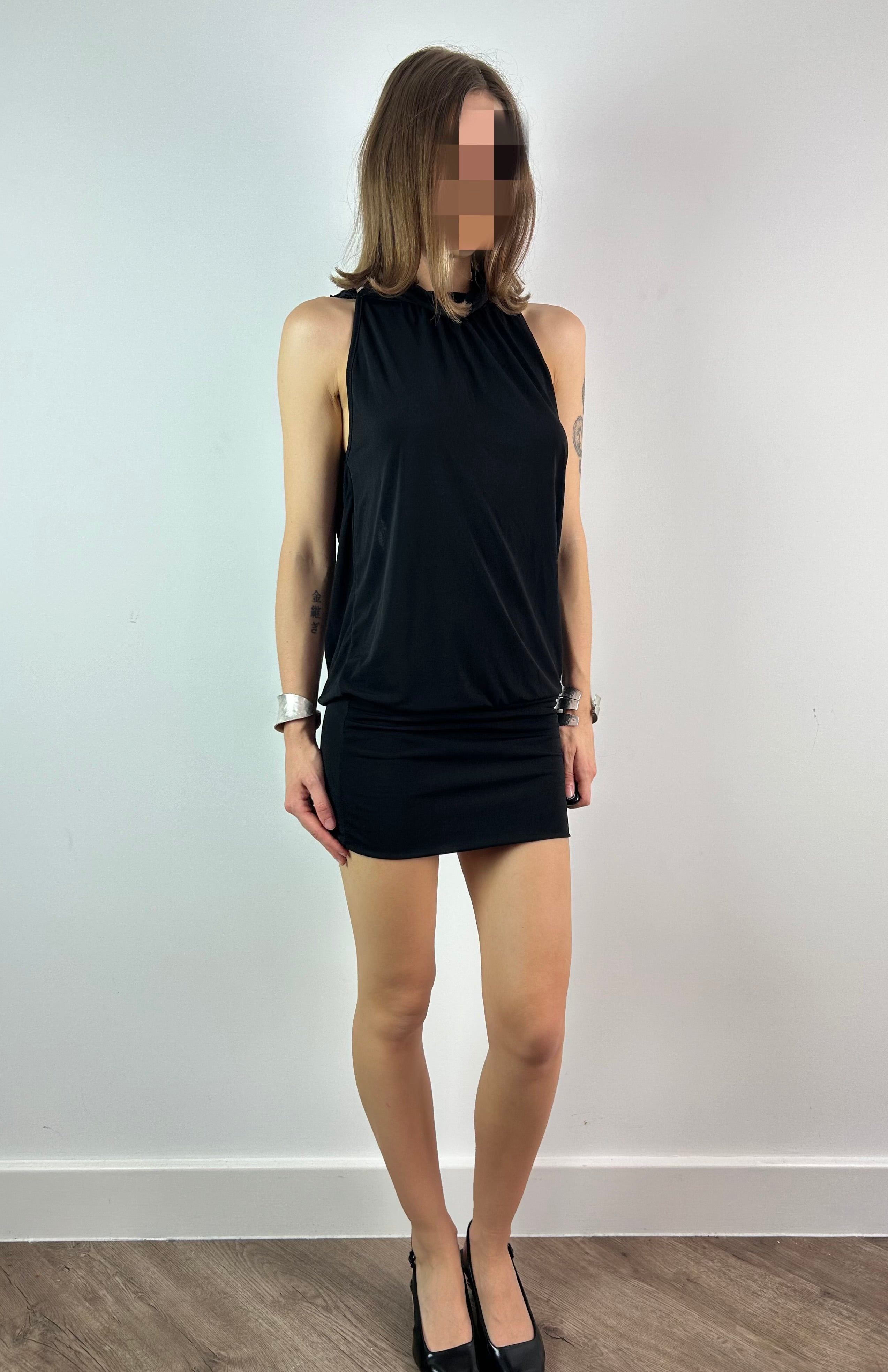 Black Mini Dress with Open Back and Beaded Necklace